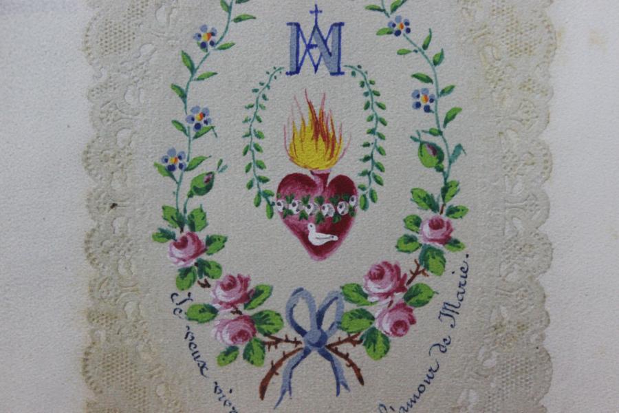 Estampa con sagrado corazón en libro de Domingo Aracena